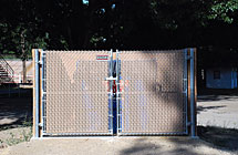 Pleasant Grove - Rodeo Grounds Dumpster Enclosure - 6’ High Double Gate with Tan Tube Slats & Fulcrum Latch